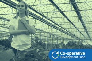 Young female farmer working in a greenhouse
